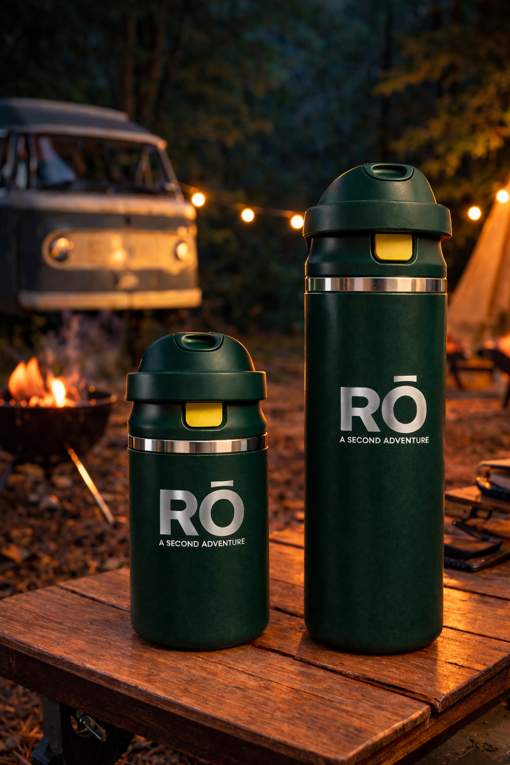 Two green water bottles with 'RO' branding on a wooden table outdoors.